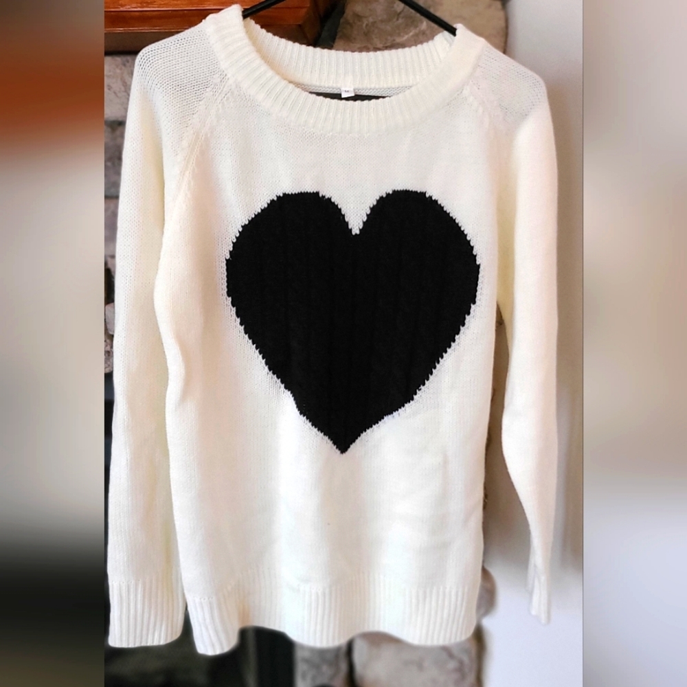 Sweater with cable knit heart